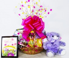 Celebrate Mom with Keepsakes and Treats
This medium basket contains a keepsake mug, mother's day plaque, women's magazines or Mom book, plush bear, large fruit juices and snacks including cookies, crackers, chocolate and more