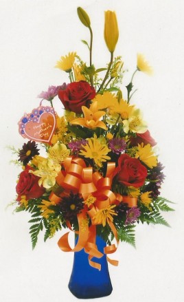 Our classic medium mixed vase arrangement boasts a colorful mix or roses Asiatic lilies and a variety of daisies and more!